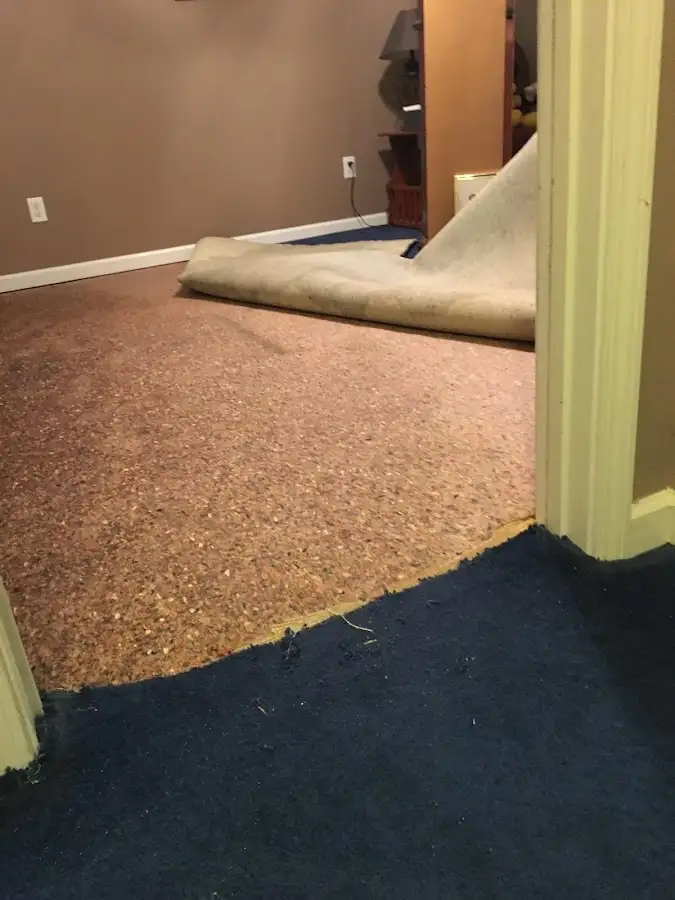 Carpet pad removal revealing water damage during Drying & Dehumidification in Liberty Lake